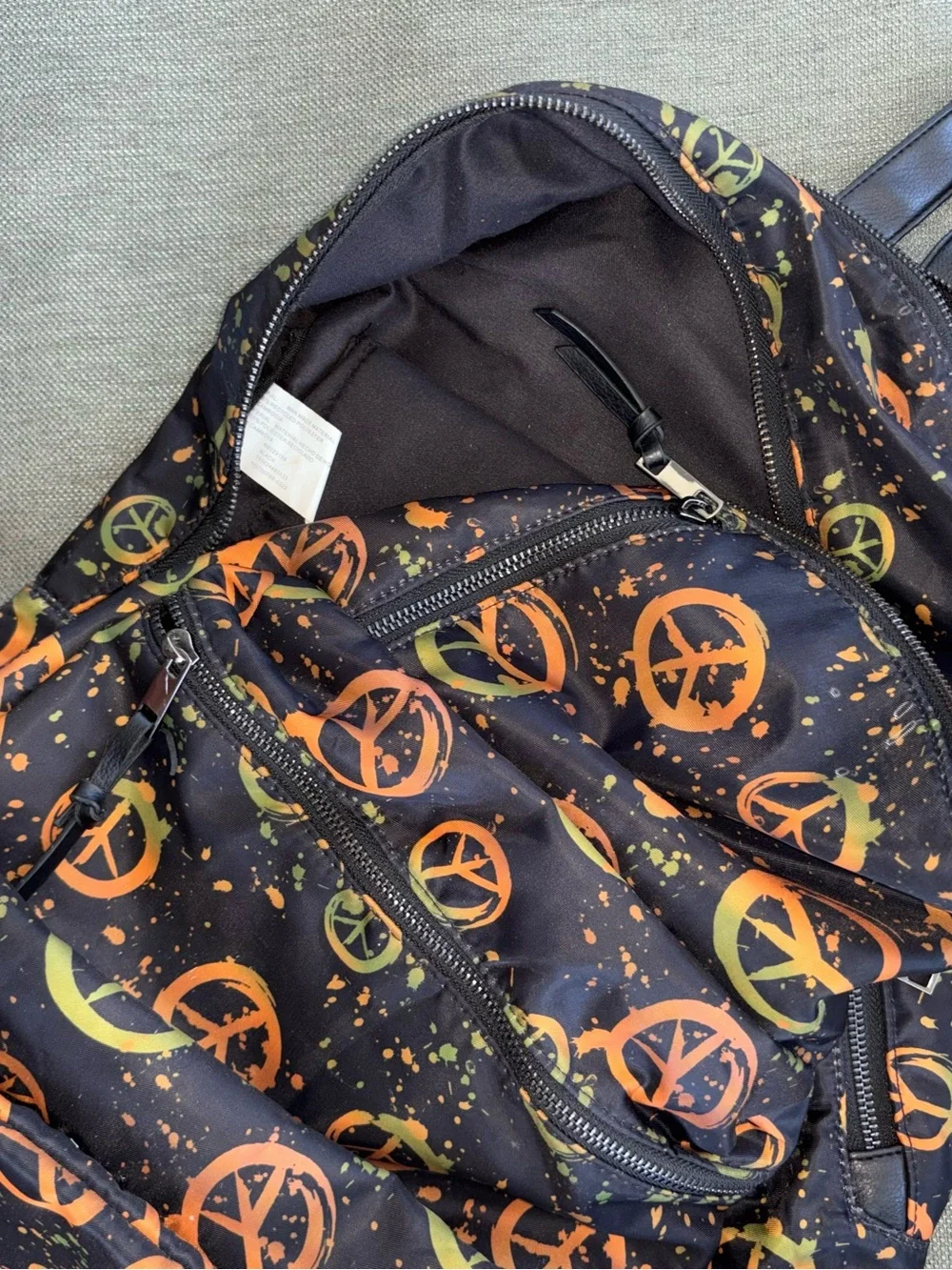 DSW Gray Casual Backpacks with Black and Orange Peace Print Accent